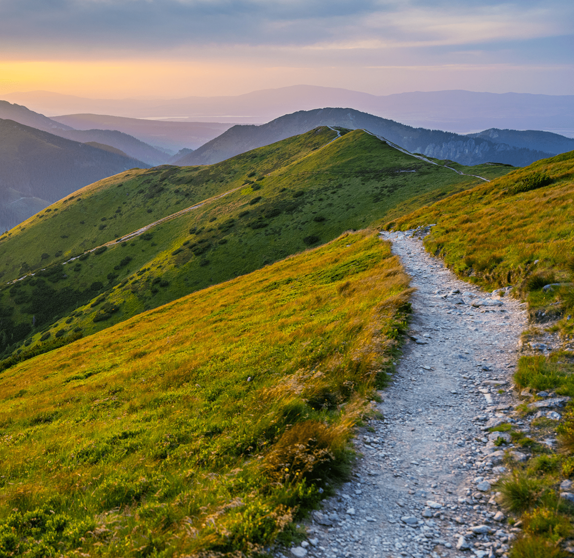 Mountain path with scenic sunset view.