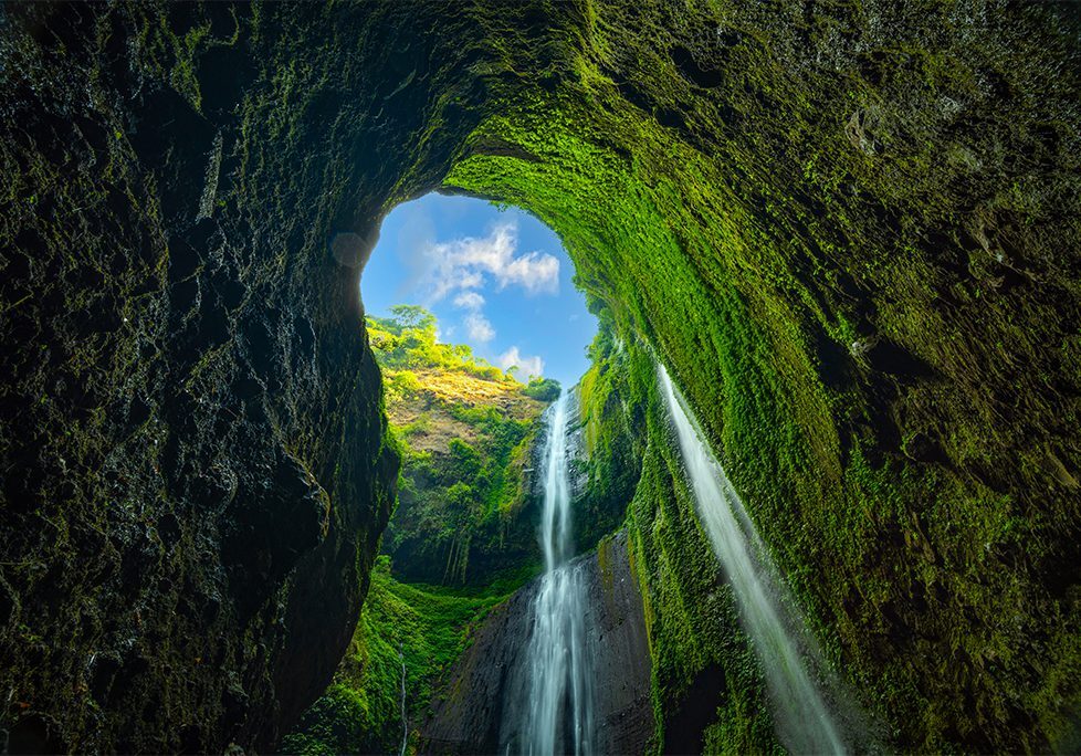 _0010_GettyImages-1688286430 A waterfall is seen through the opening of an arch.