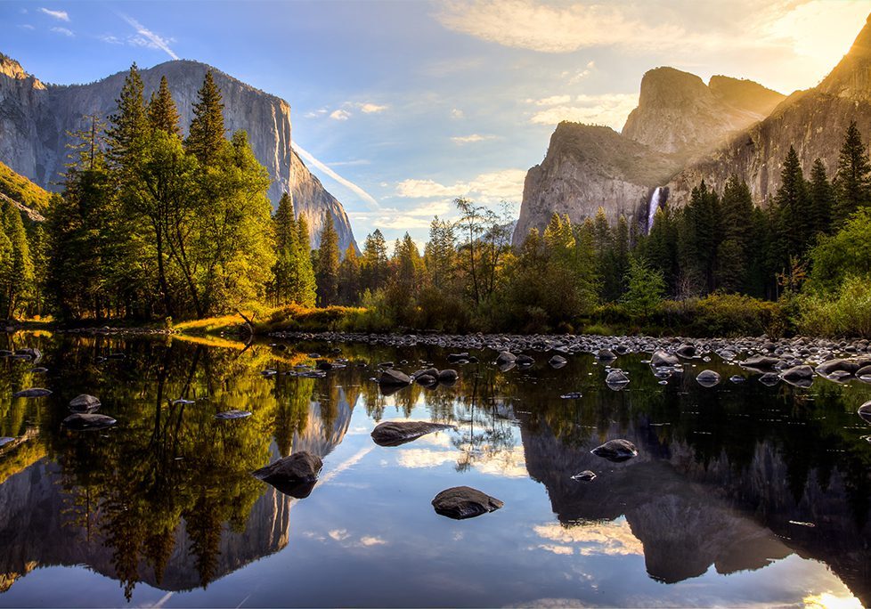 _0023_GettyImages-505872990 A river with rocks in the water and mountains