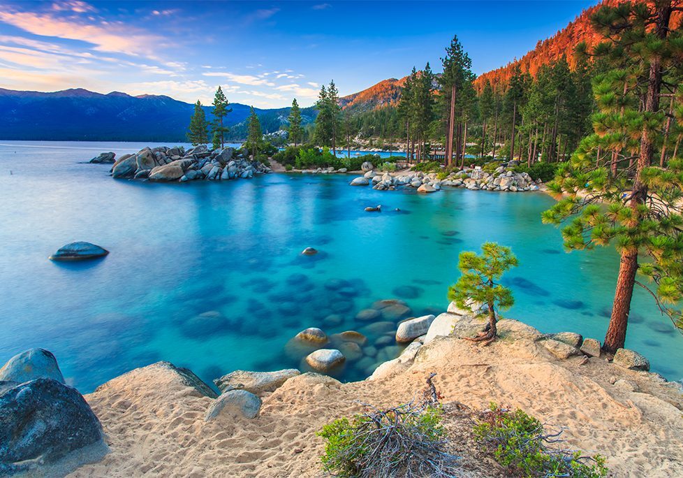 _0025_GettyImages-480641071 A lake with trees and rocks in the water