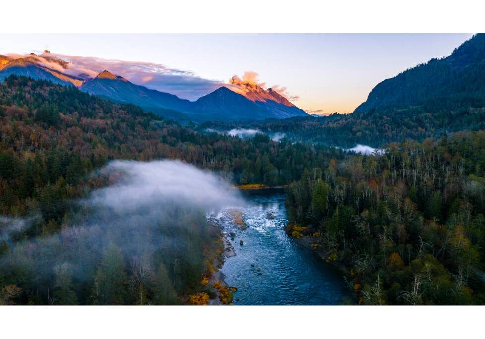 GettyImages-1283886803-1024x684-landscape-26cbdb8d (1) (1) A river flowing through the middle of a forest.